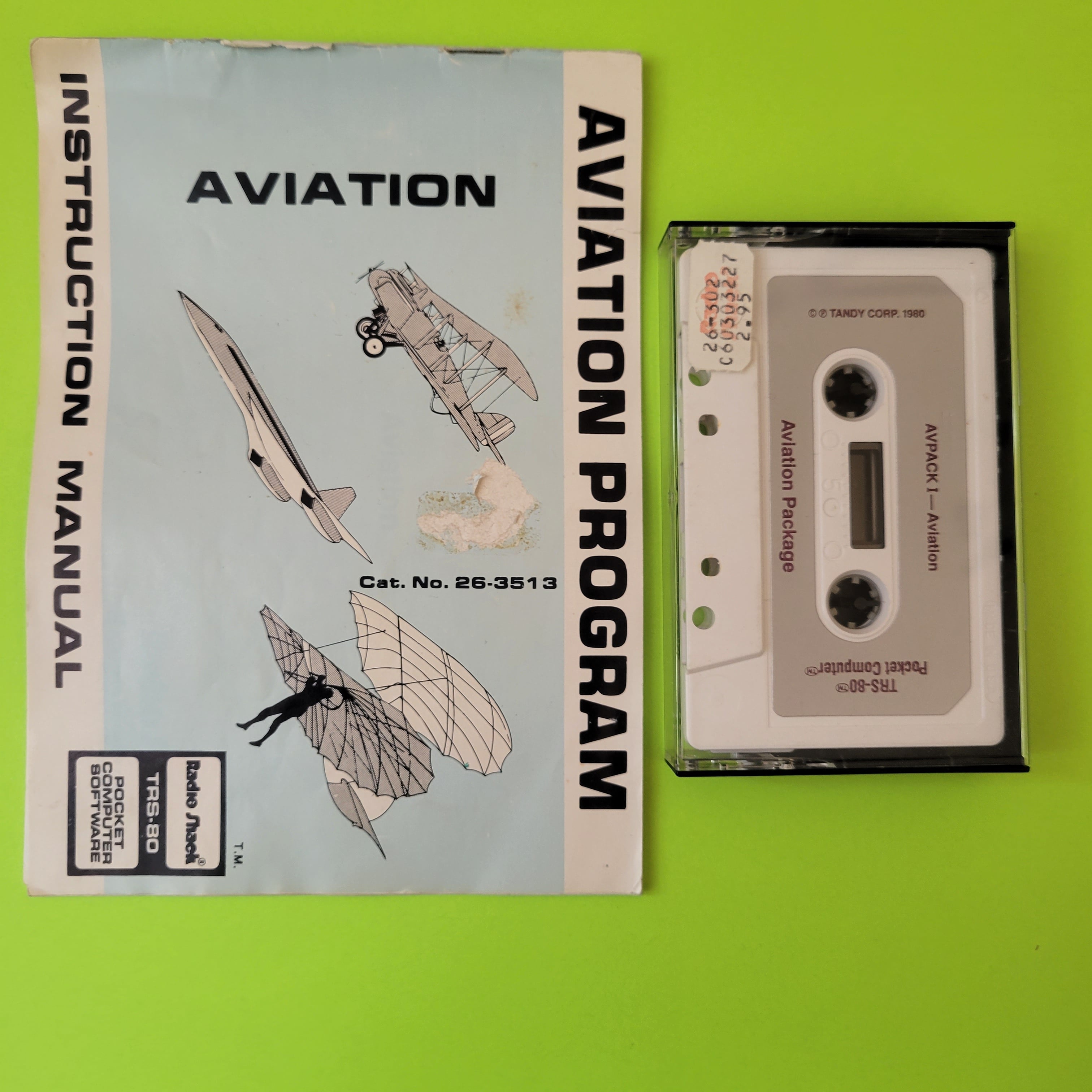 An image of the front of a Radio Shack TRS-80 aviation cassette and manuel